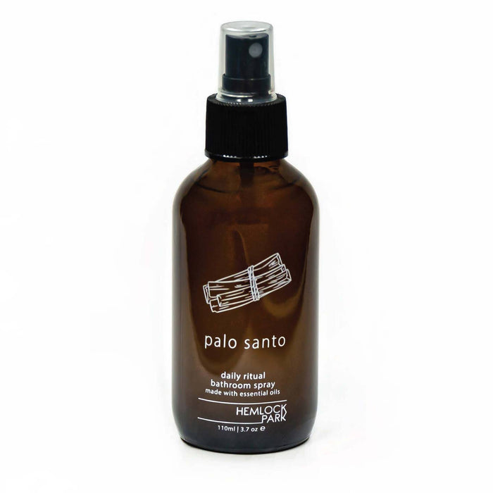 Daily Ritual room spray in amber glass bottle with black mist pump, palo santo label