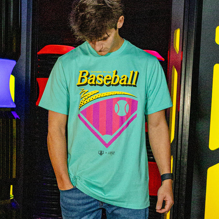 Person wearing a teal t-shirt with 'Baseball' graphic design in front of colorful background
