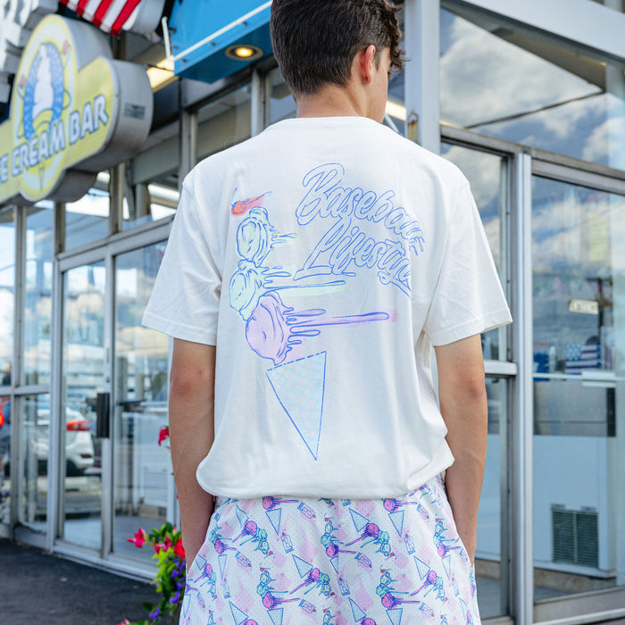 Adult model wearing cream Fastball Scoops graphic tee