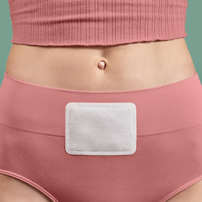 Model wearing Rael Heating Patch over underwear on lower abdomen.