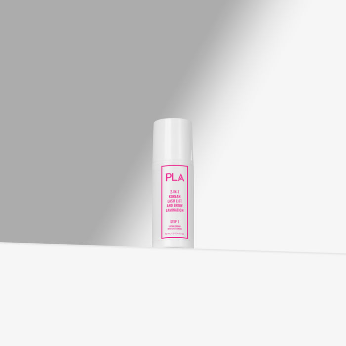 White cylindrical container with pink text on a gray background