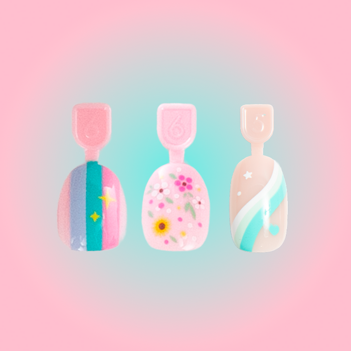 Pressies Trendy Trio featuring three colorful press-on nails with rainbow stripes, floral, and swirl designs for kids and tweens