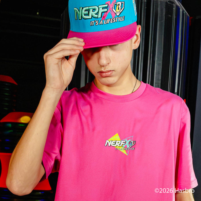 Person wearing a colorful 'NERF X BL101' cap and t-shirt with a blurred background