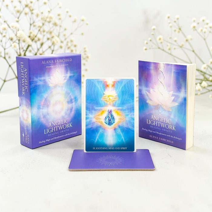 Two books titled 'Angelic Lightwork' by Alana Fairchild on a white surface with decorative elements.