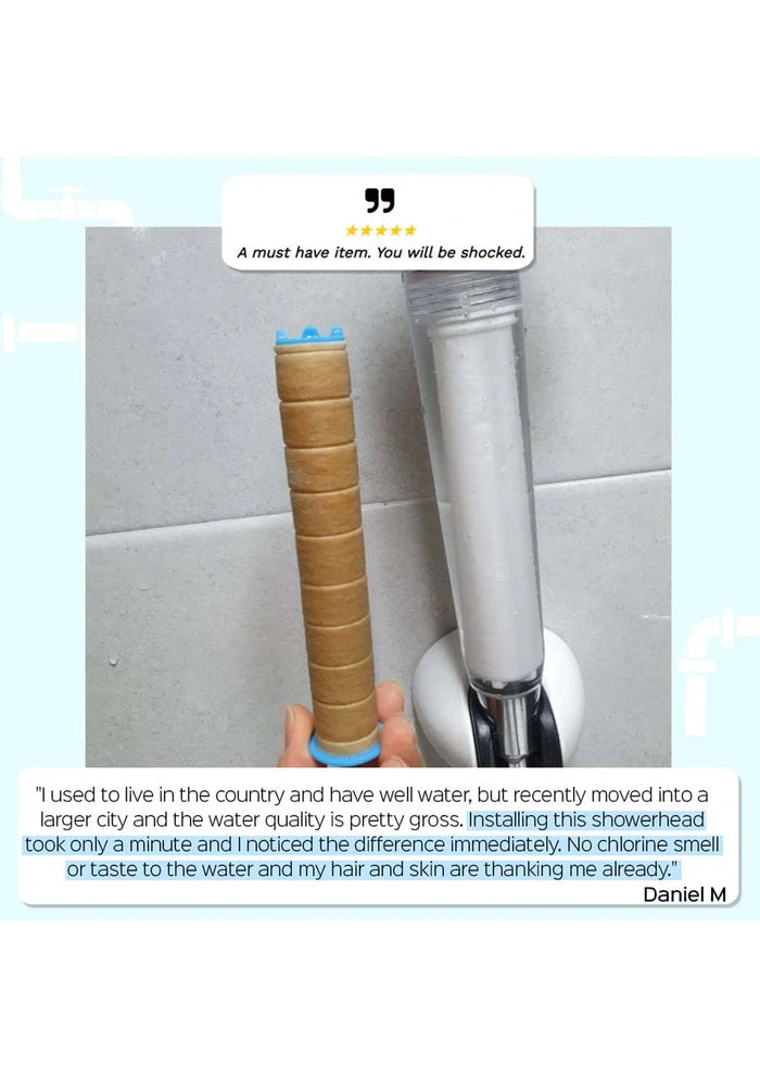 Showerhead being held by a hand with a review text overlay on a tiled bathroom wall background.