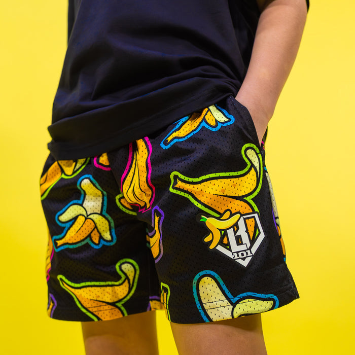 Adult model wearing black Banana Neon shorts