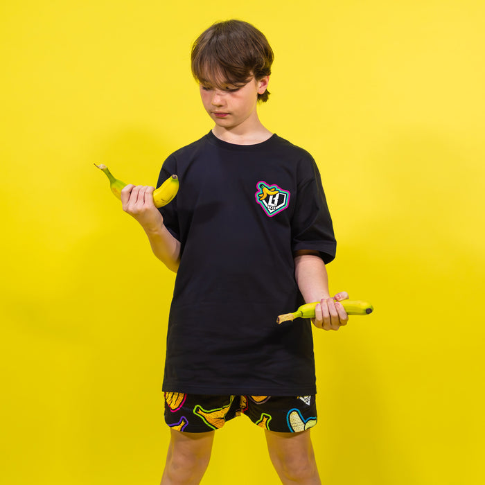 Adult model wearing black Banana Neon shorts