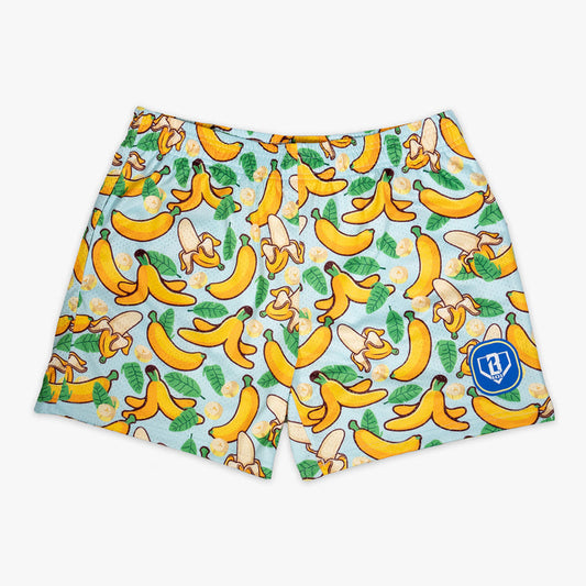 Youth model wearing yellow Banana Tropical youth shorts