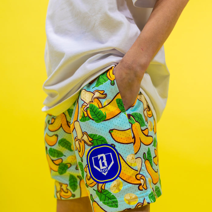 Youth model wearing yellow Banana Tropical youth shorts