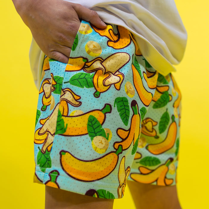 Youth model wearing yellow Banana Tropical youth shorts