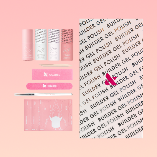 Blush Jelly Builder Gel Kit displayed with gel bottles, manicure tools, nail forms, and a branded box on a pink background
