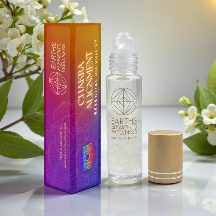 Earth's Elements Wellness Chakra Alignment essential oil roll-on with packaging on a light background.