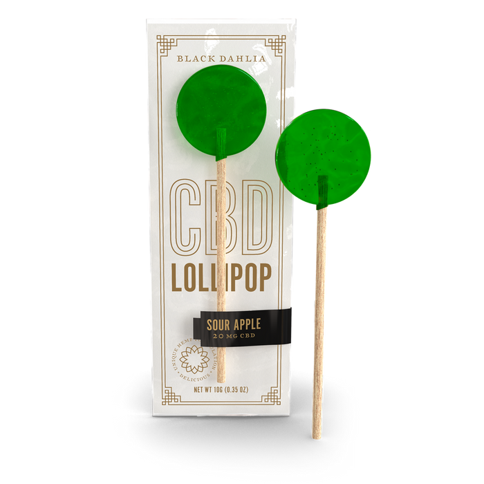 CBD sour apple lollipop with green candy on wooden stick, shown in wrapper