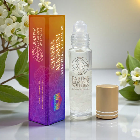 Earth's Elements Wellness Chakra Alignment essential oil roll-on with packaging on a light background.