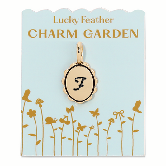 Gold scalloped initial charm from Lucky Feather Charm Garden collection, featuring a delicate letter F design.