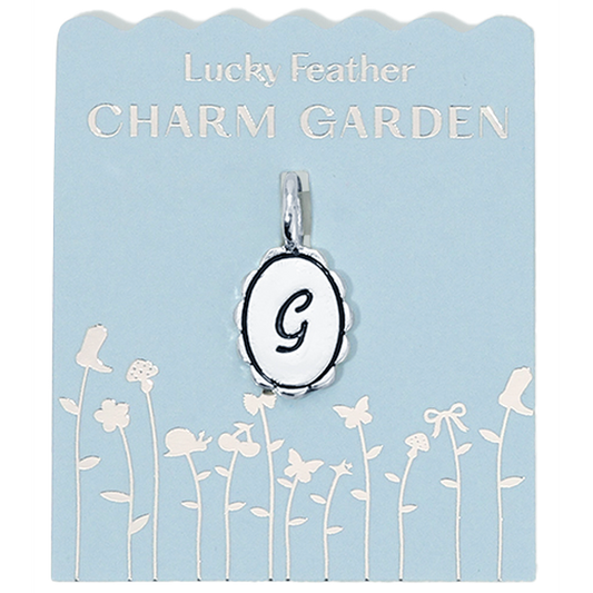 Silver Charm Garden initial G charm with scalloped edges, designed by Lucky Feather, featuring intricate detailing.