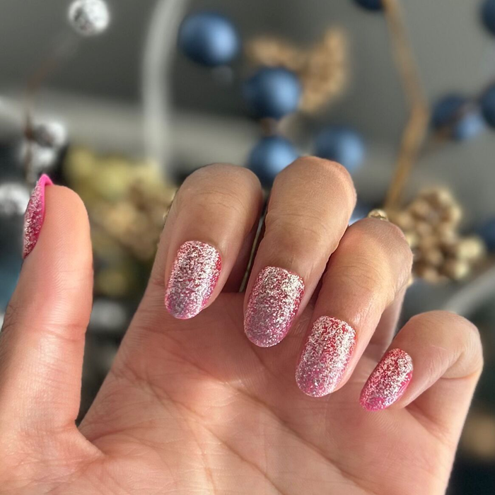 Cherry Super Sparkle - Press On | Short | Round showing candy cherry-pink glitter packed false nails in a short round shape manicure