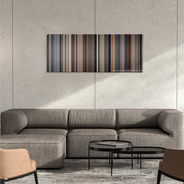 City of Angels color palette canvas on a concrete wall above a gray sectional sofa