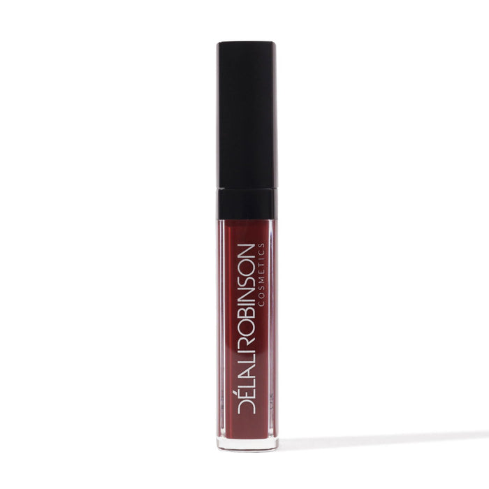 red brown matte liquid lipstick bottle on white background with Delali Robinson
