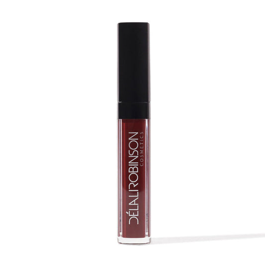 red brown matte liquid lipstick bottle on white background with Delali Robinson
