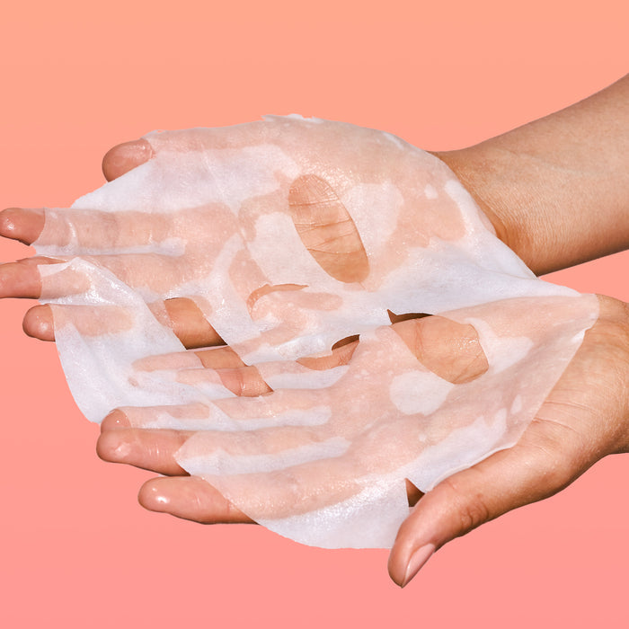 Rael face sheet mask in hands.