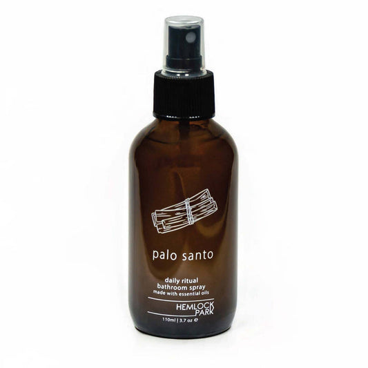 Daily Ritual room spray in amber glass bottle with black mist pump, palo santo label