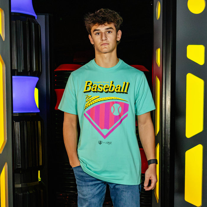 Person wearing a teal t-shirt with 'Baseball' design in a colorful, futuristic setting