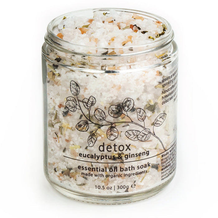 Jar of detox essential oil bath soak with eucalyptus & ginseng label, black lid