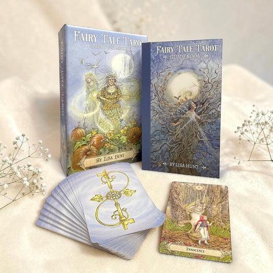 Fairy Tale Tarot cards with packaging and a few cards displayed on a light background.