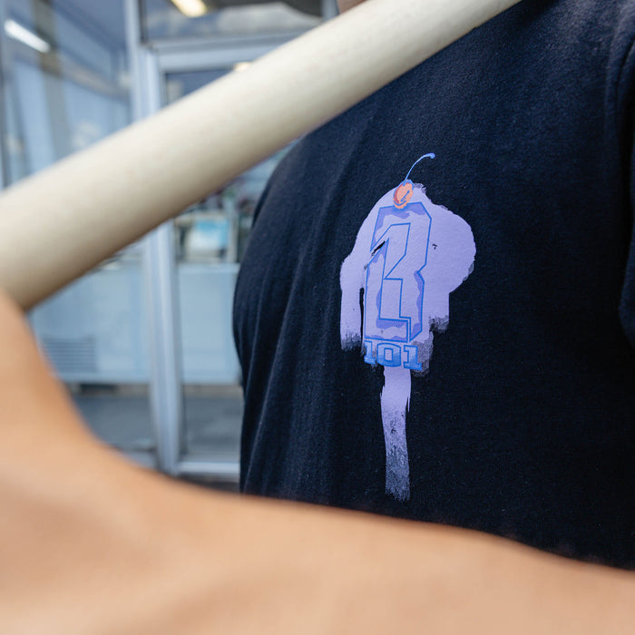 Adult model wearing black Fastball Scoops graphic tee
