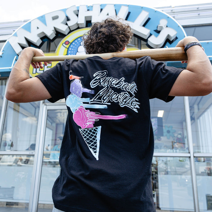 Adult model wearing black Fastball Scoops graphic tee
