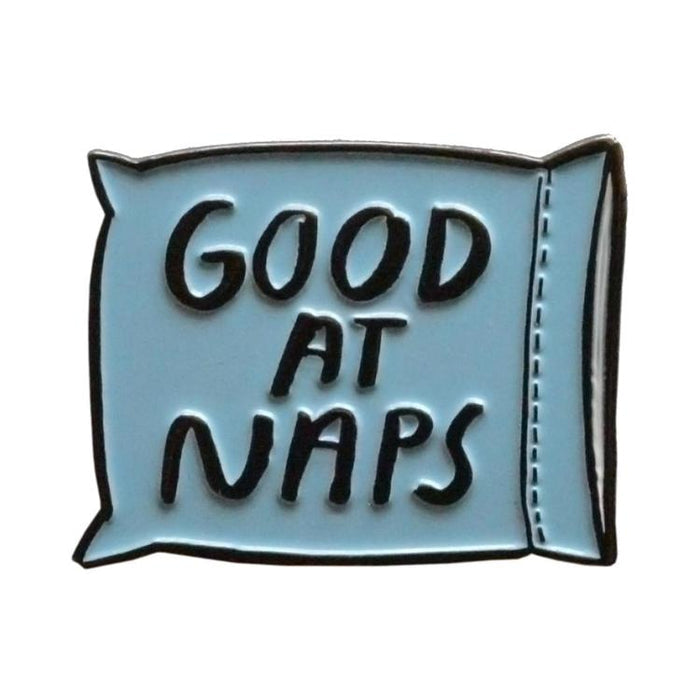 Blue enamel pin reading 'Good at Naps'