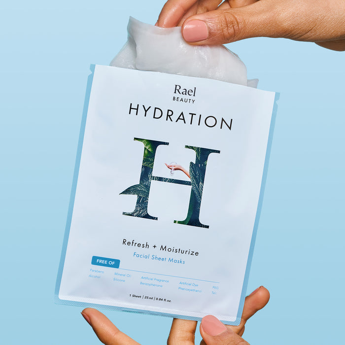 Model removing a Rael Hydration Face Sheet Masks from individually wrapped package.