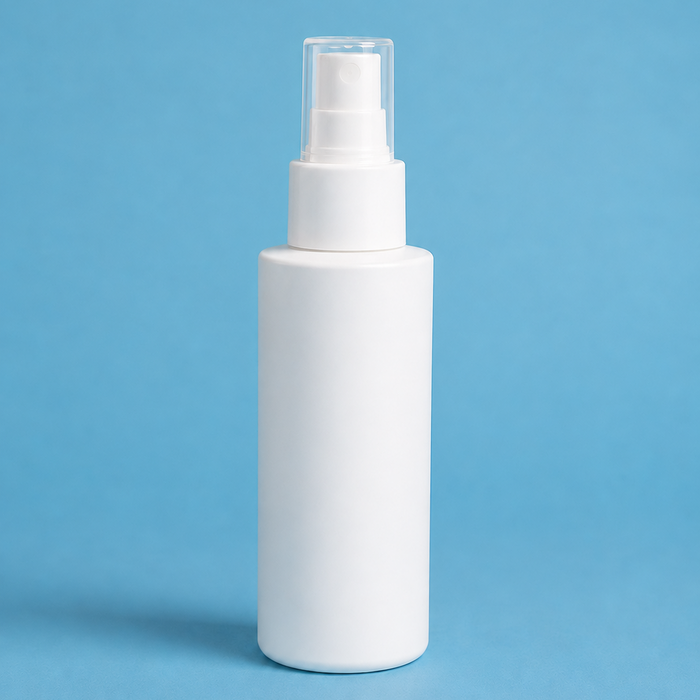 White spray bottle on a blue background