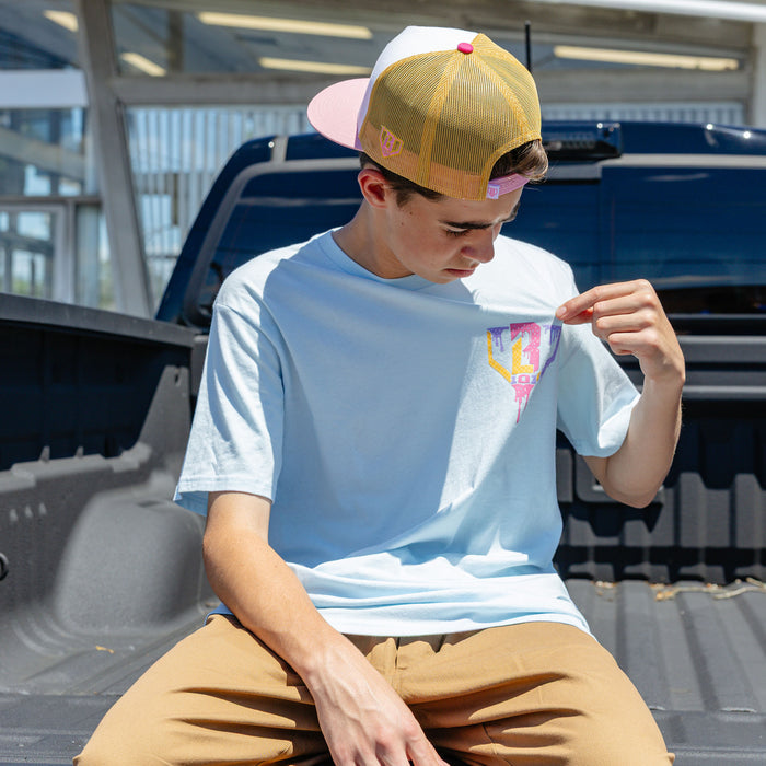 Adult model wearing blue Ice Cream Frosted graphic tee