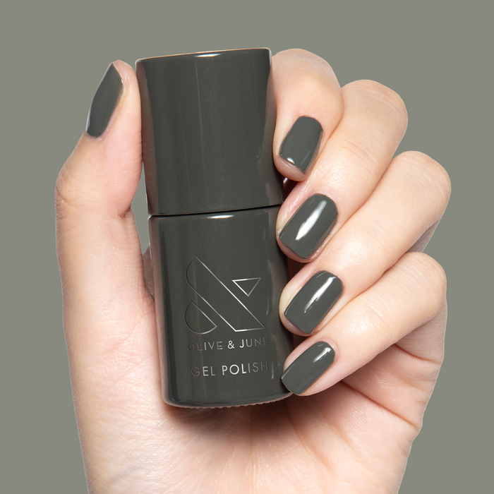 Is It Smoky In Here? Gel on short natural nails with deep charcoal gray for a sleek manicure by Olive and June
