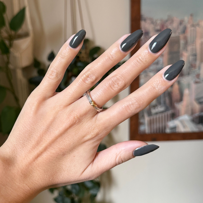 Is It Smoky In Here? Gel on long almond-shaped nails in deep charcoal gray for a smooth at-home manicure