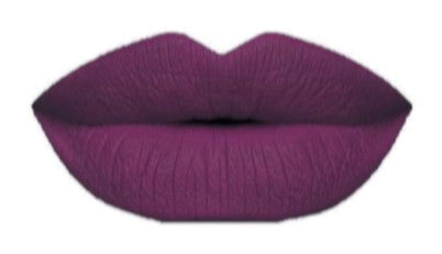 Jamm lipstick swatch on full lips — rich berry matte finish