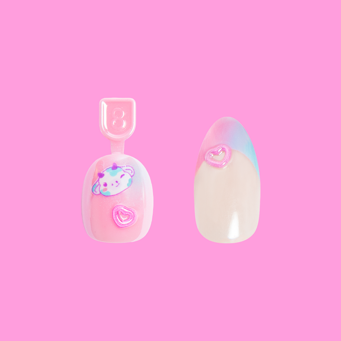 Kawaii Cow Set featuring two press-on nails with cow design and pink heart accents on pastel background