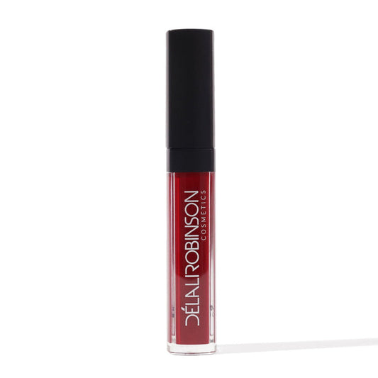 A tube of red matte liquid lipstick with a black cap, labeled 'Delilah Robinson' on a white background.