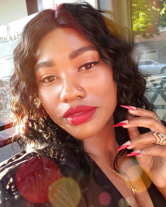 woman wearing kiss me lipstick