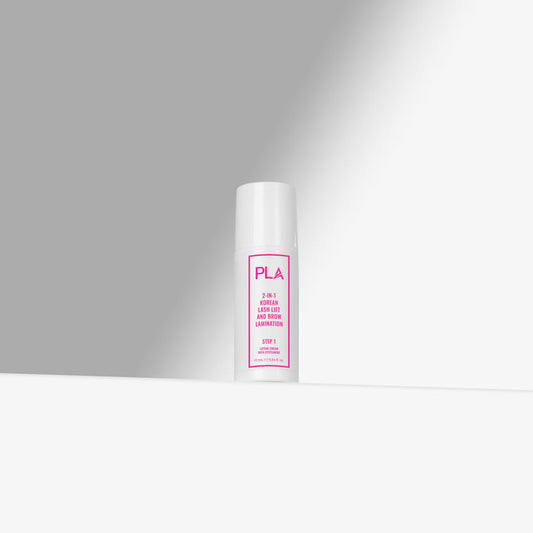 White cylindrical container with pink text on a gray background