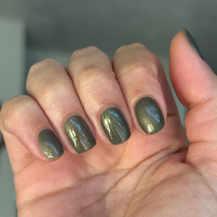 Martini Chrome Gel deep olive green gel polish with golden shimmer on short natural nails for a sleek manicure