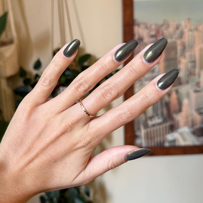 Martini Chrome Gel long almond-shaped nails in deep olive green with golden shimmer for a polished mani by Olive and June