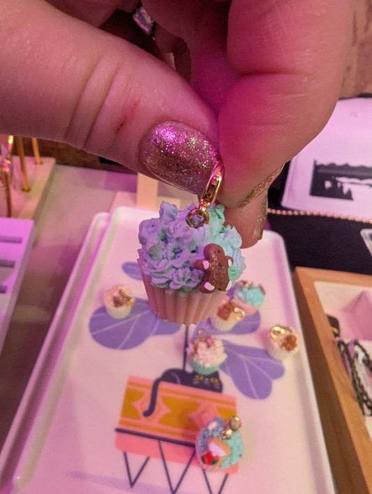 Miniature cupcake charm by Detail In Miniature, featuring a detailed small cupcake with colorful frosting and sprinkles.