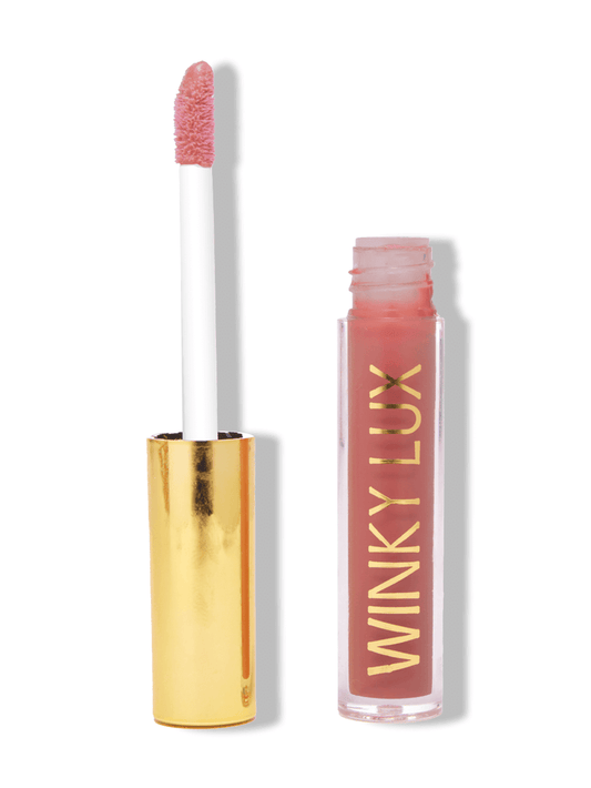 Mini muse very there lip oil open with cap next to on white background