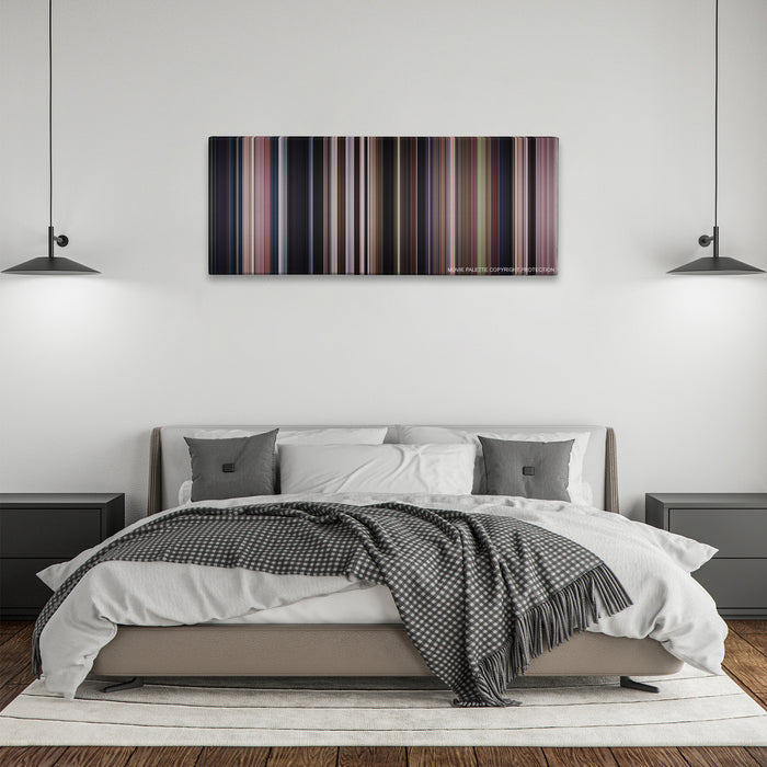 Monster color palette canvas above a bed, between two black pendant lamps