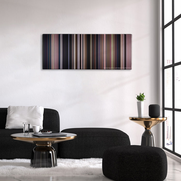 Monster color palette canvas above a black sofa with a gold-topped table