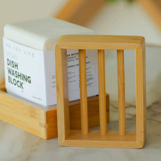 Bamboo soap dish with slatted sides and square frame, holds bar soap