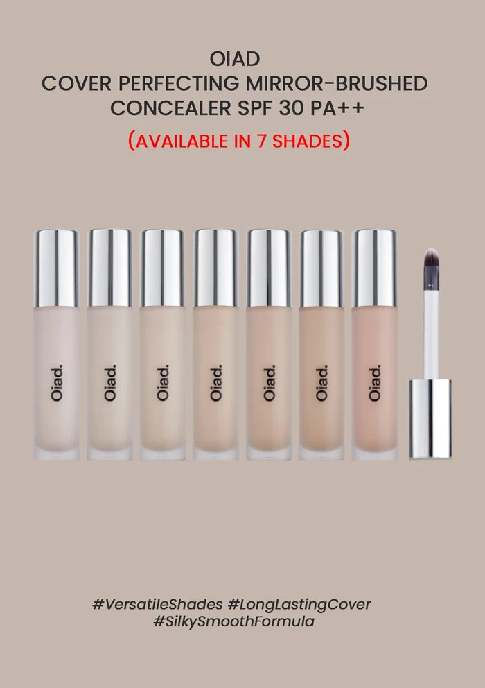Set of OIAD concealer bottles with a brush on a beige background